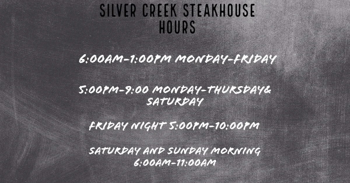 Operating hours for Silver Creek Steakhouse displayed on a chalkboard