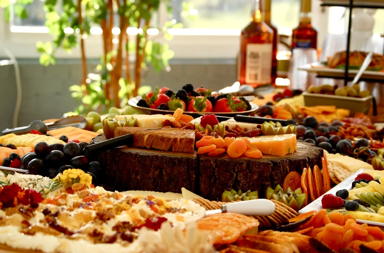 Artisan cheese and charcuterie board with fresh fruits