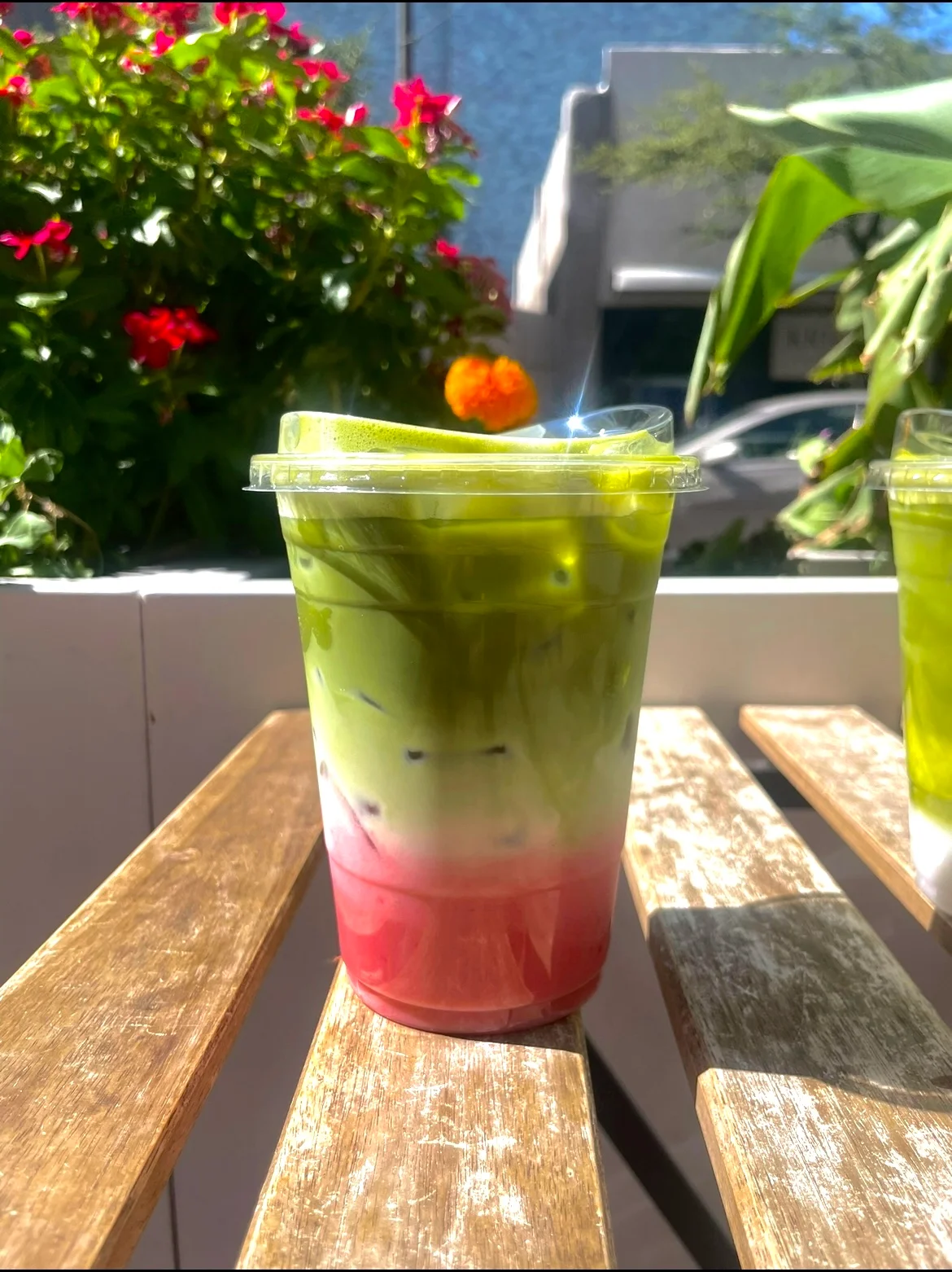 Layered matcha and strawberry drink