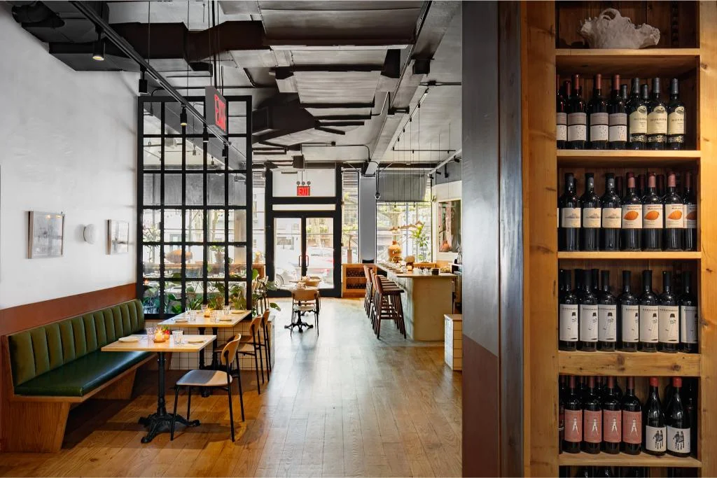 Stylish restaurant interior with wooden accents and wine display