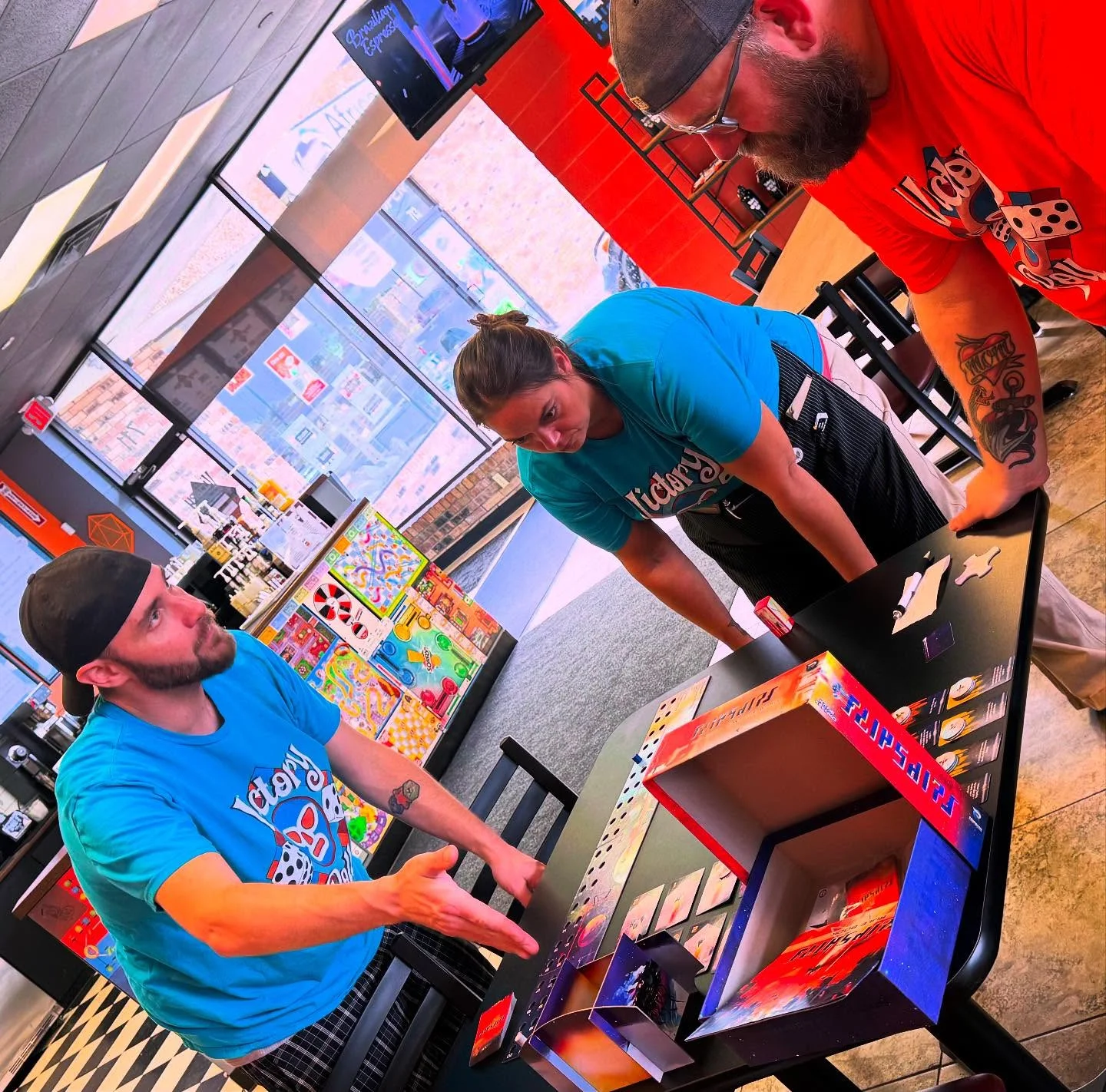 Group of friends playing a board game in a vibrant cafe
