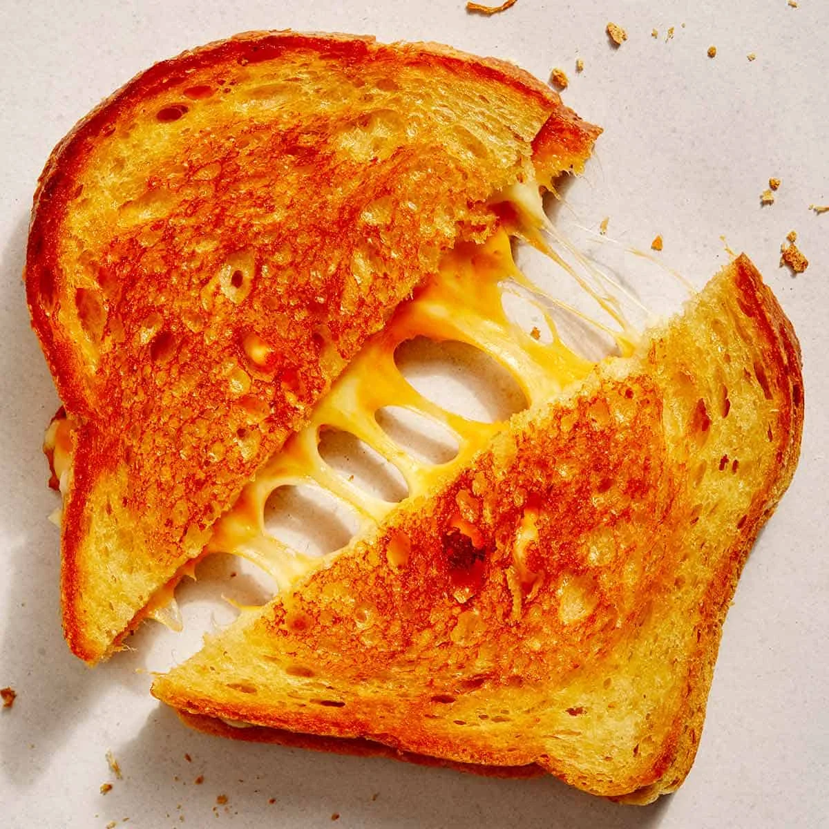 Golden grilled cheese sandwich with melted cheese