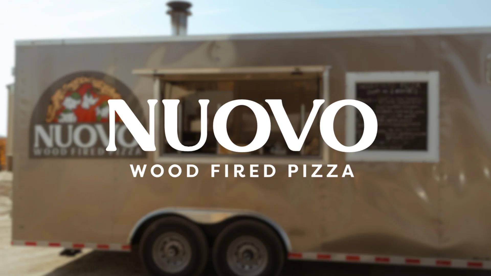 Nuovo wood-fired pizza food truck serving artisanal pizzas