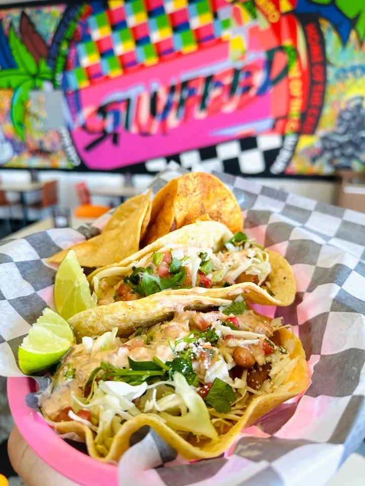 Shrimp taco platter with cabbage slaw, pico de gallo and tortilla chips at Stuffed Burritos