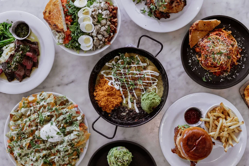 Assorted global dishes including nachos, steak, and pasta
