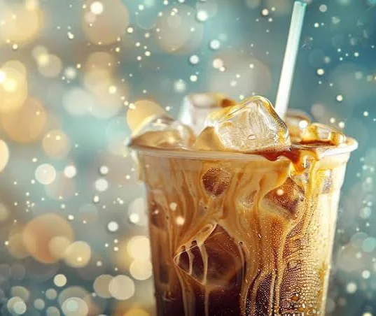 Coffee cup on a wooden windowsill with warm sunlight