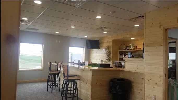 Modern bar interior with wooden accents and seating