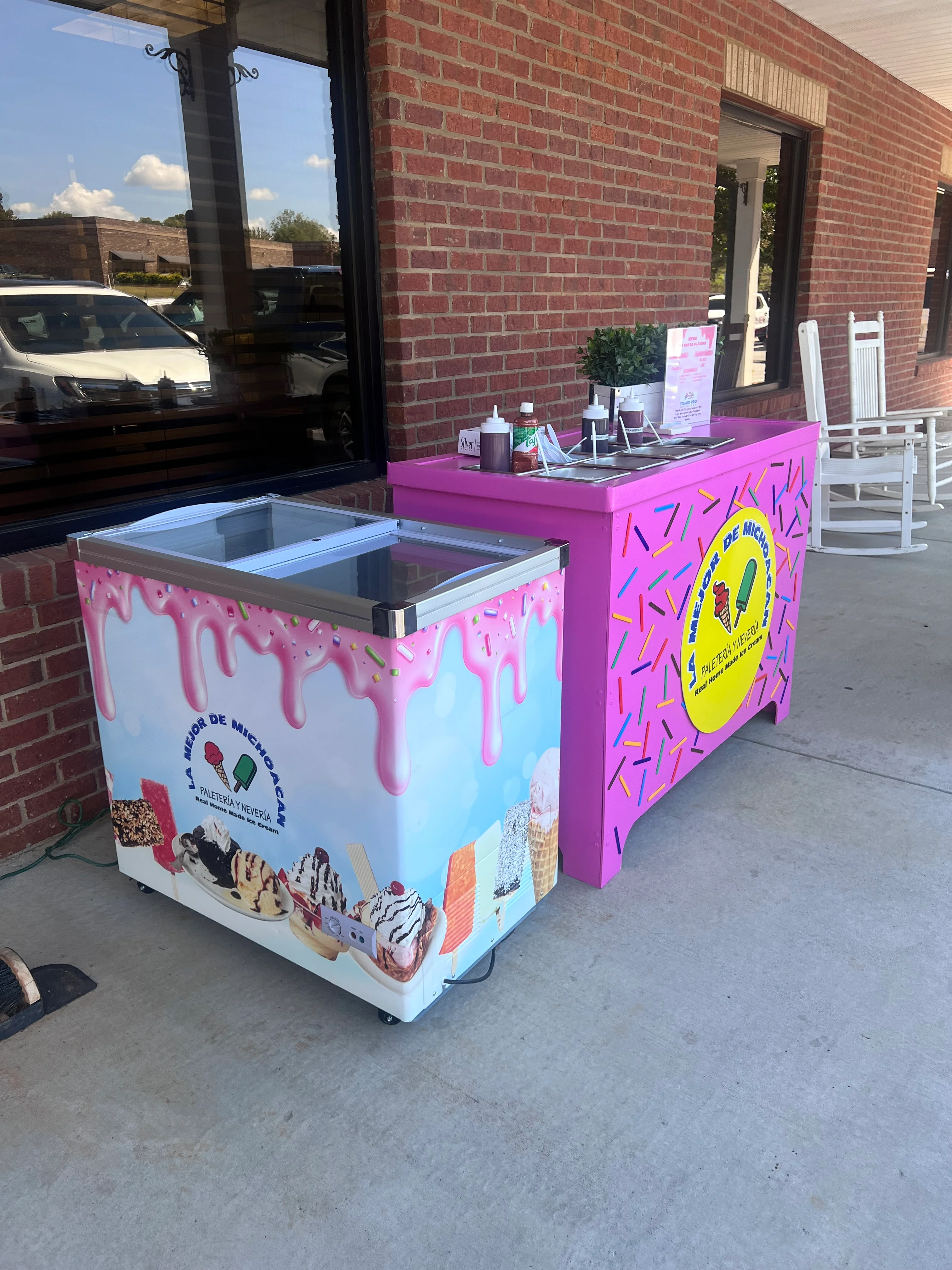Colorful ice cream carts outside a shop