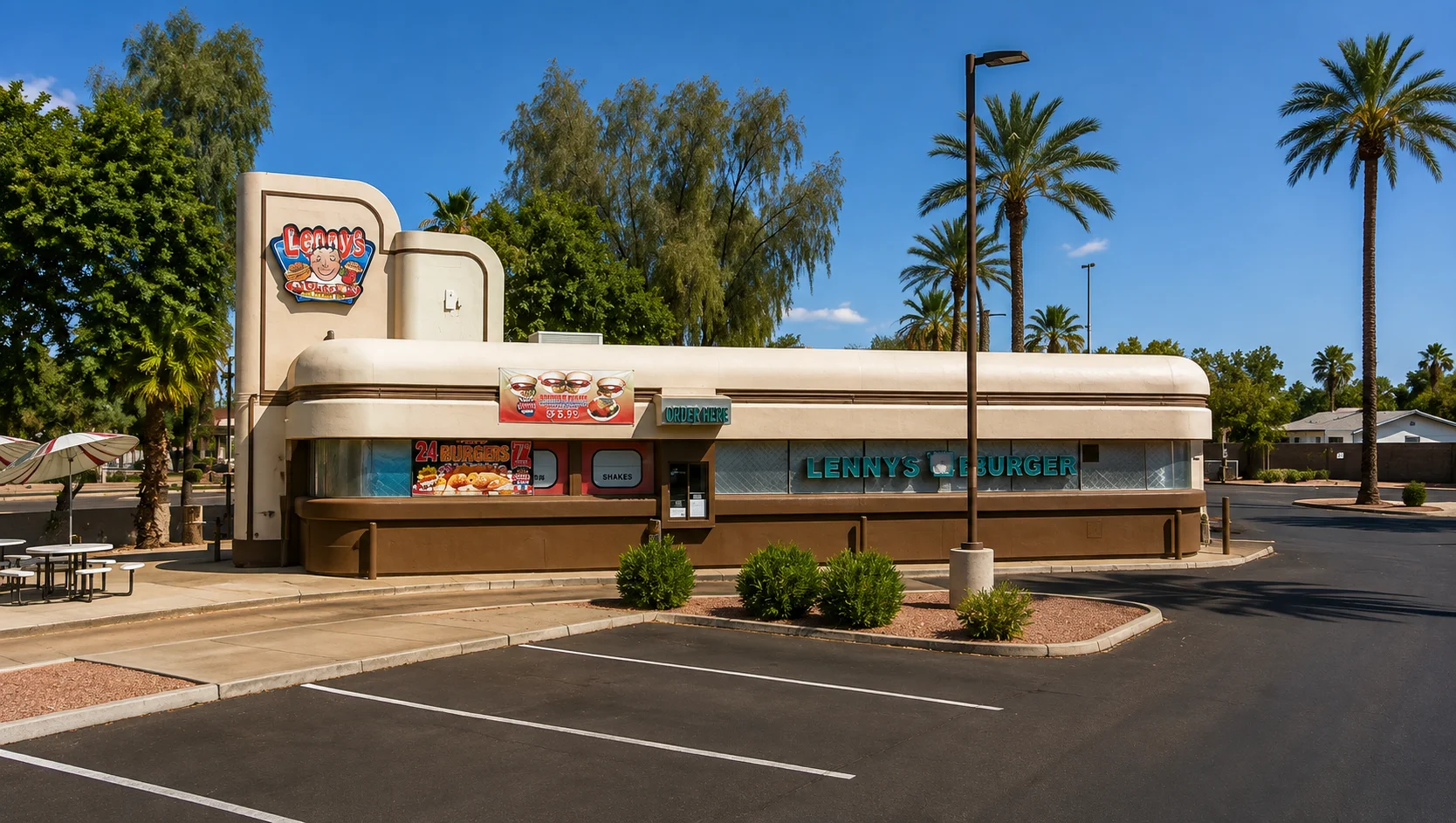 Exterior view of Lenny's Burger restaurant with palm trees