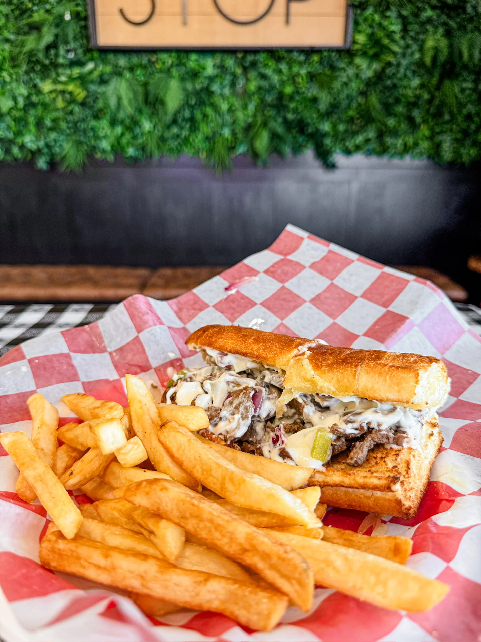 Delicious cheesesteak sandwich with fries