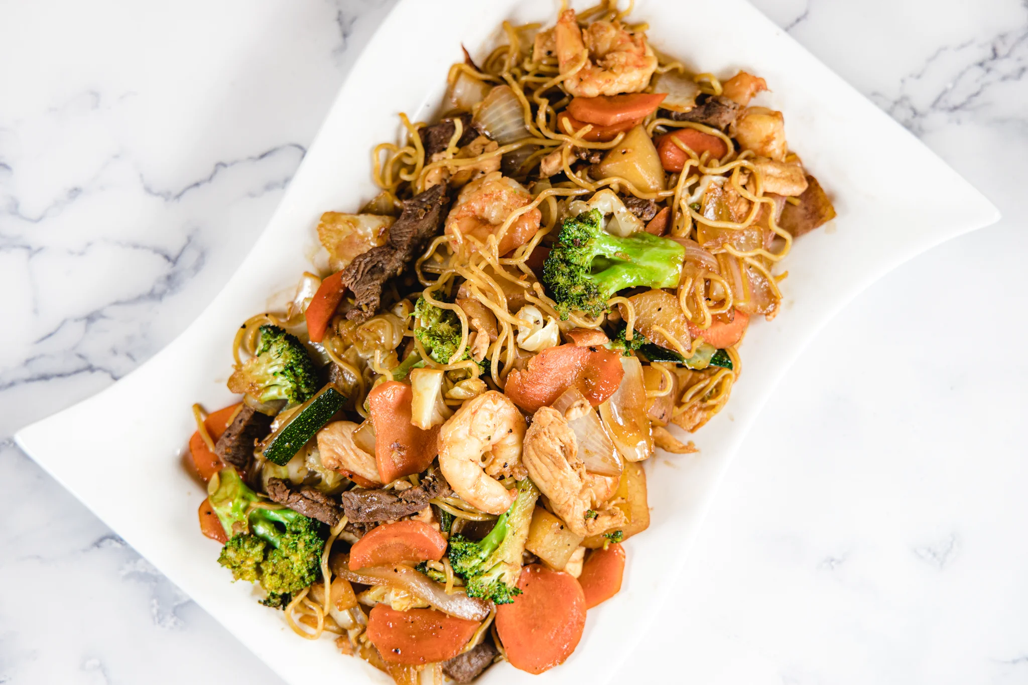 Delicious shrimp and chicken chow mein with fresh vegetables