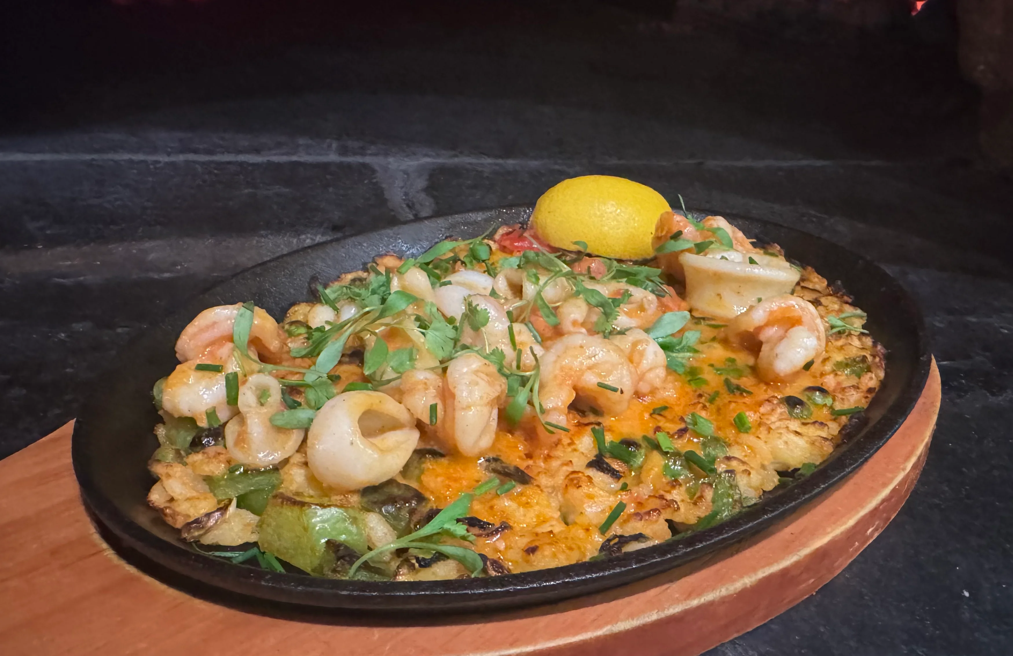 Guests can enjoy global plates inside Exit 4 Food Hall in Mount Kisco like this beautiful seafood risotto
