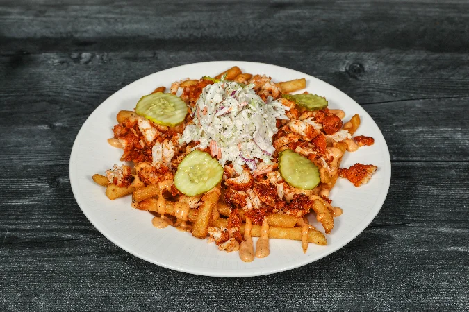 Delicious plate of Nashville hot chicken served with fries.