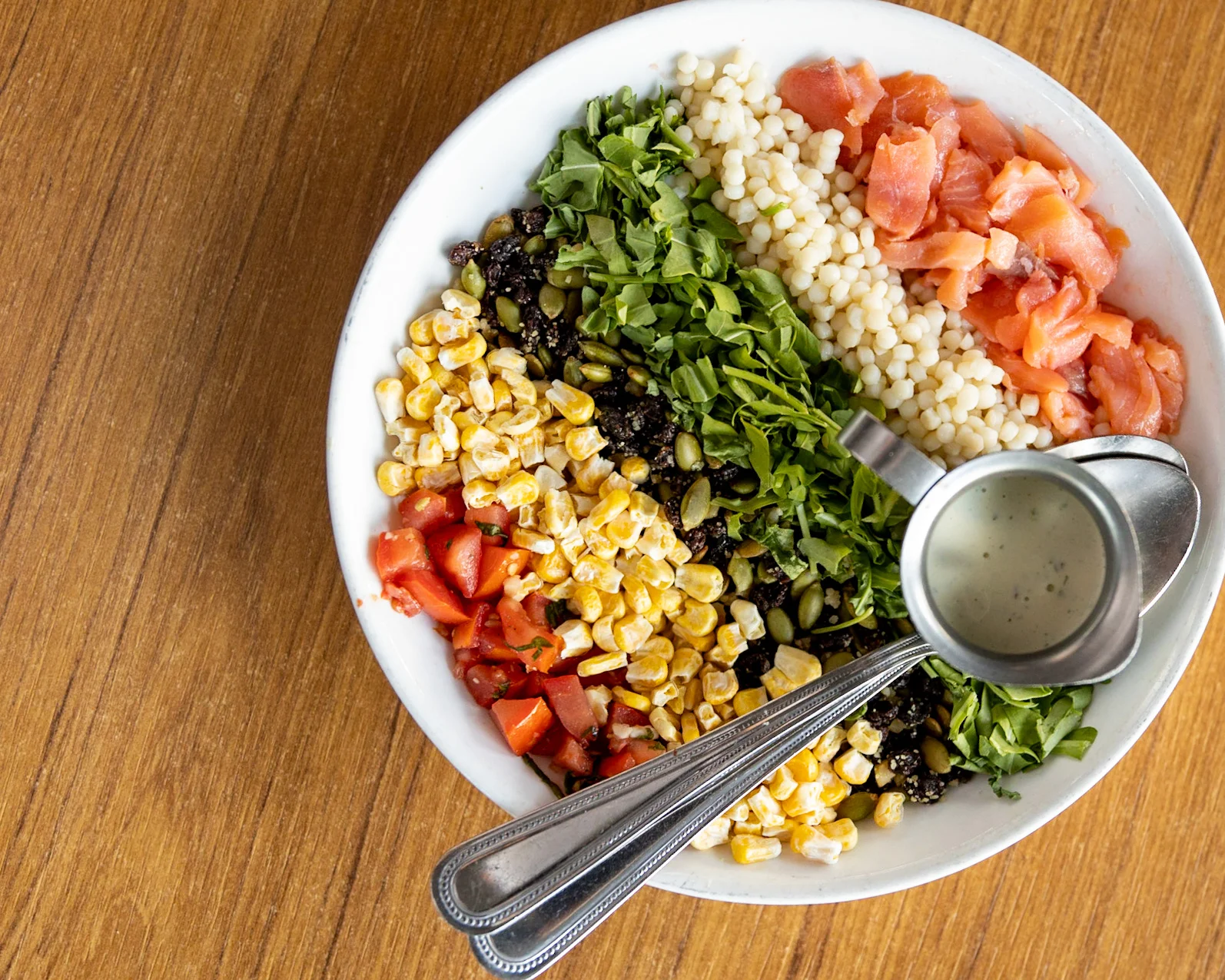 Fresh Mediterranean grain bowl with salmon and vegetables