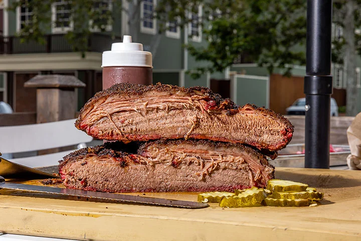 Smoked Texas brisket served with pickles