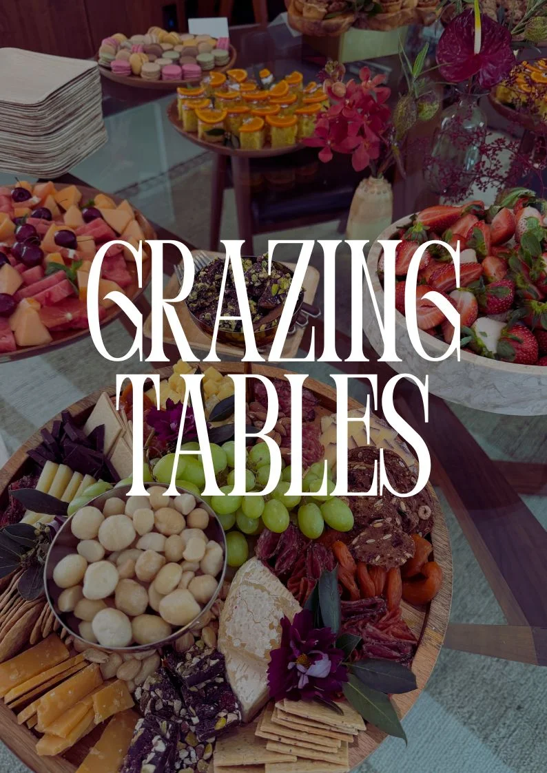 Artfully arranged grazing table with assorted cheeses and fruits