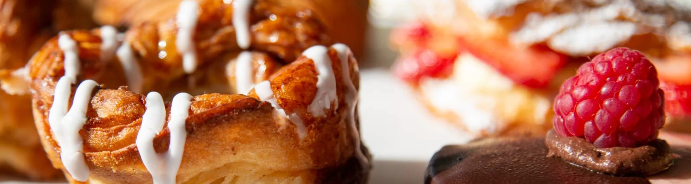 Freshly baked Danish pastry with raspberry and chocolate