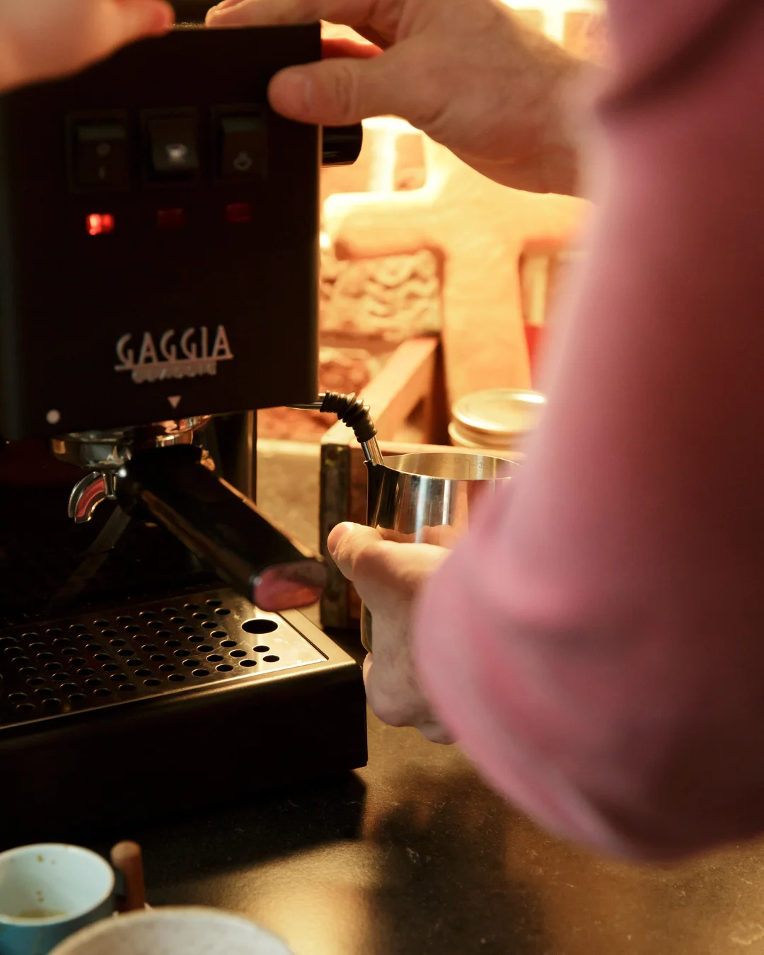 Barista operating a Gaggia espresso machine