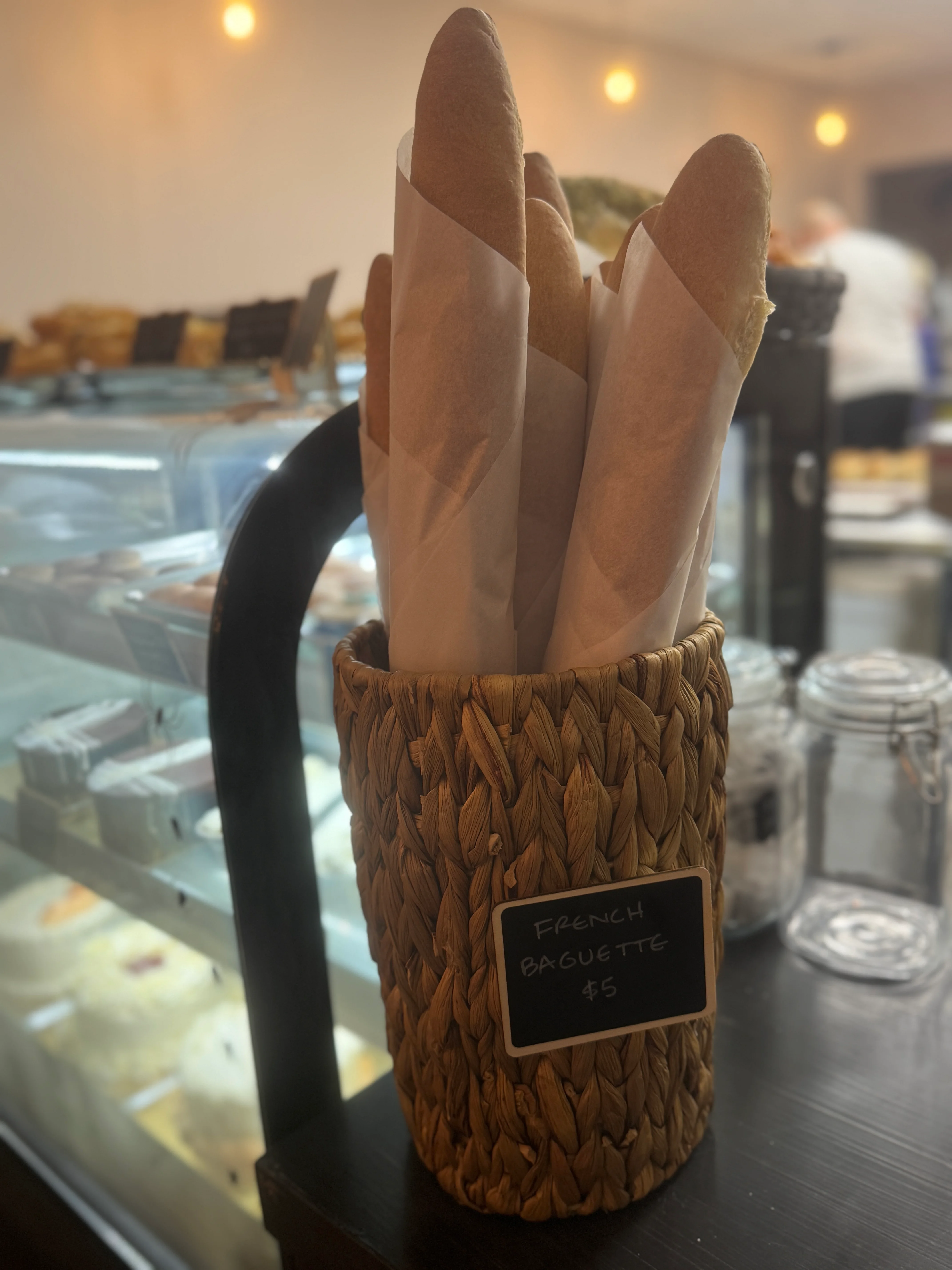 Freshly baked French baguettes in a rustic basket