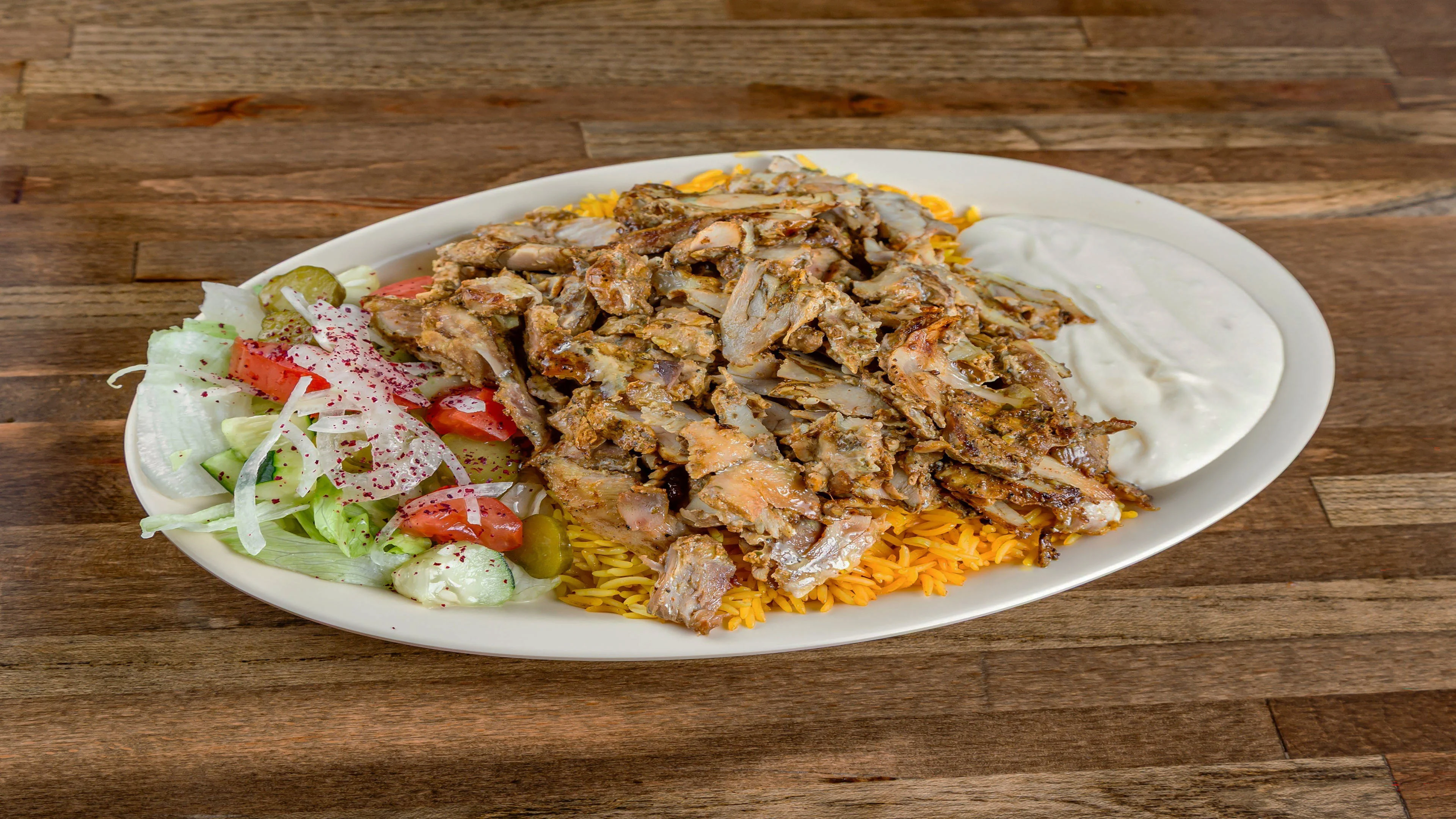 Pita Zone shawarma plate with seasoned rice and salad