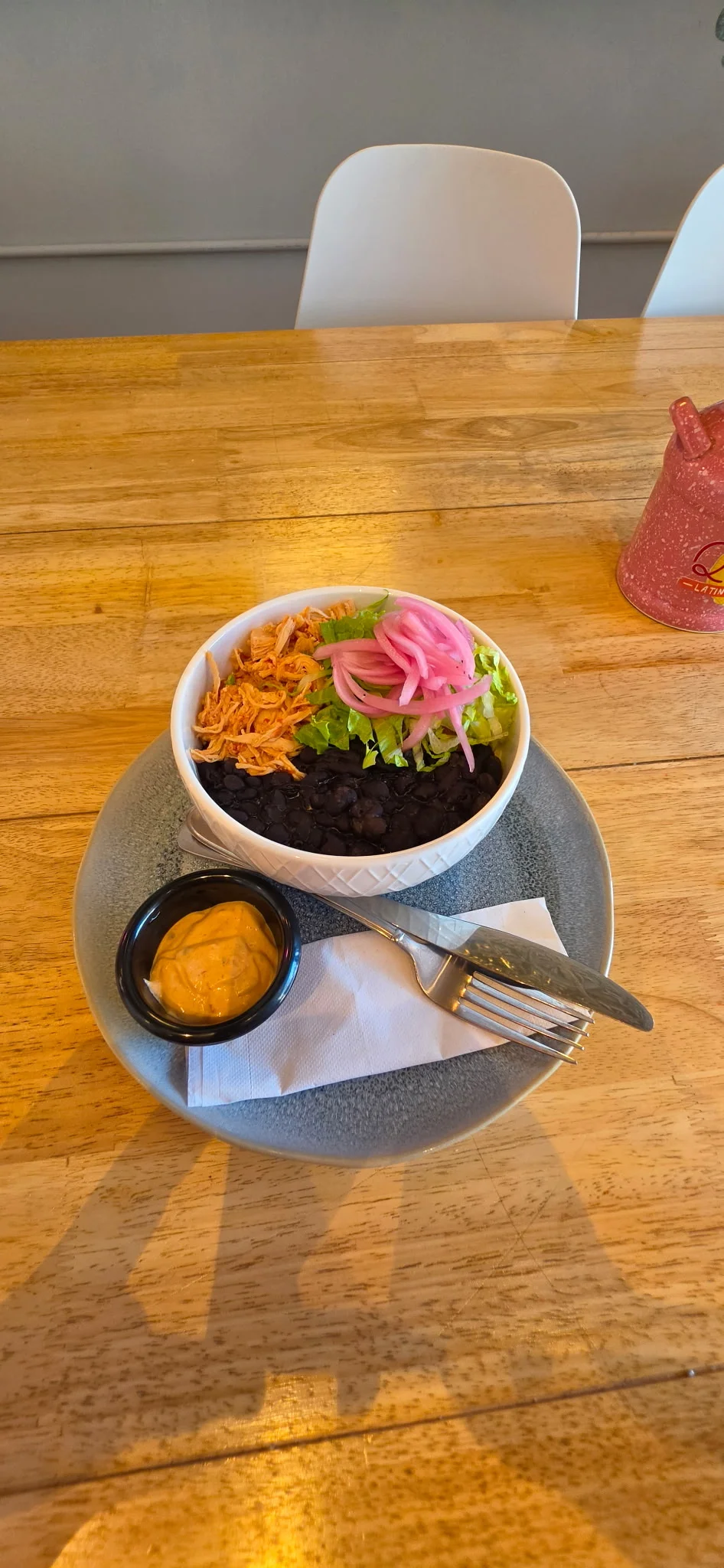 Colorful Mexican burrito bowl with black beans and fresh toppings