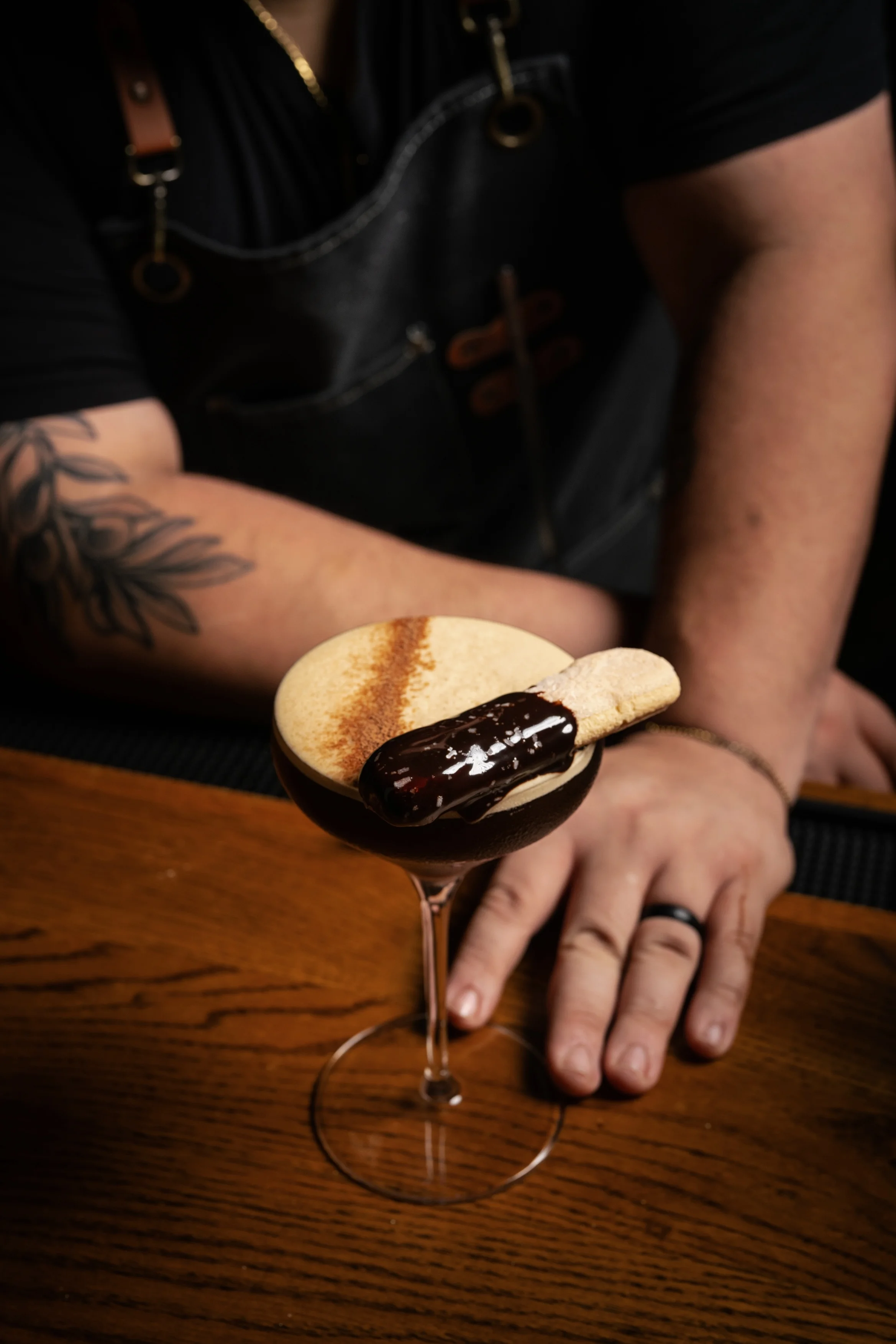 Crafted espresso martini with a chocolate-dipped biscuit