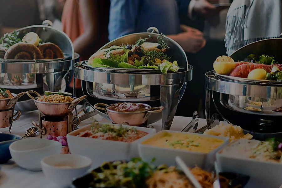 Catering package with assorted dishes and elegant presentation.