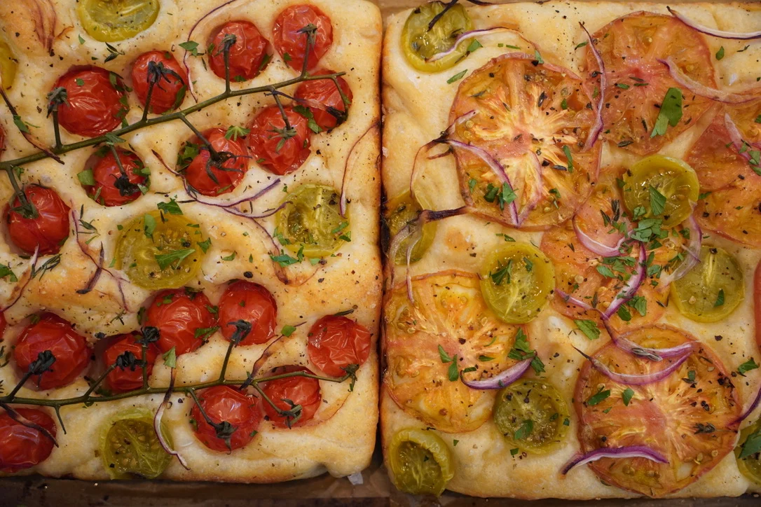 Italian focaccia bread topped with heirloom tomatoes