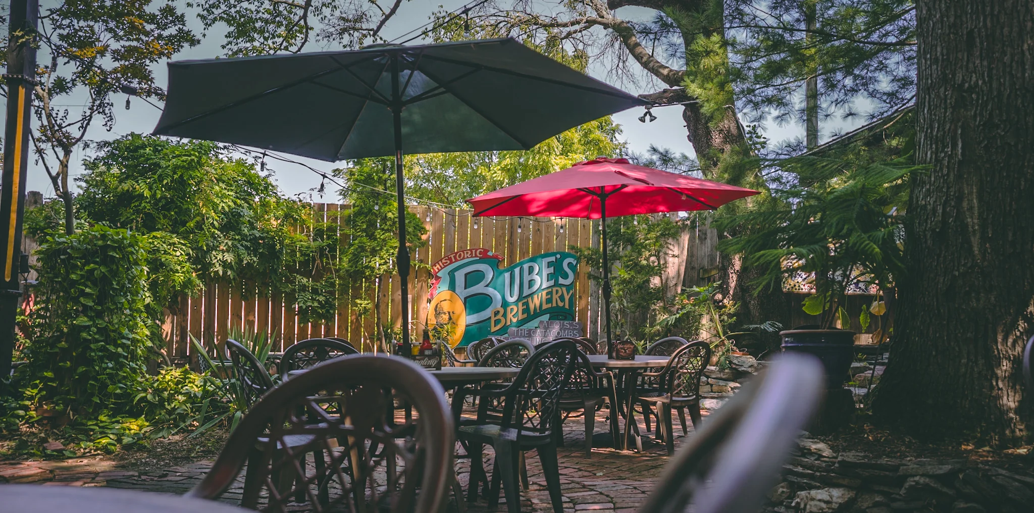 Outdoor dining area at Bube's Brewery with colorful umbrellas
