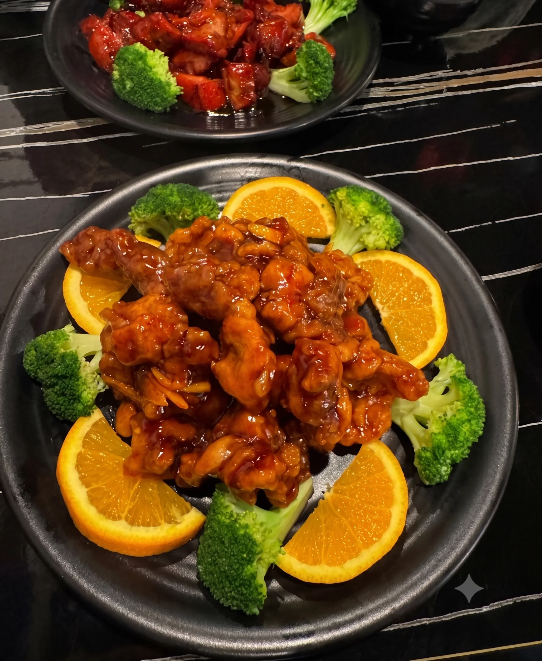 Orange chicken and sweet and sour pork with broccoli