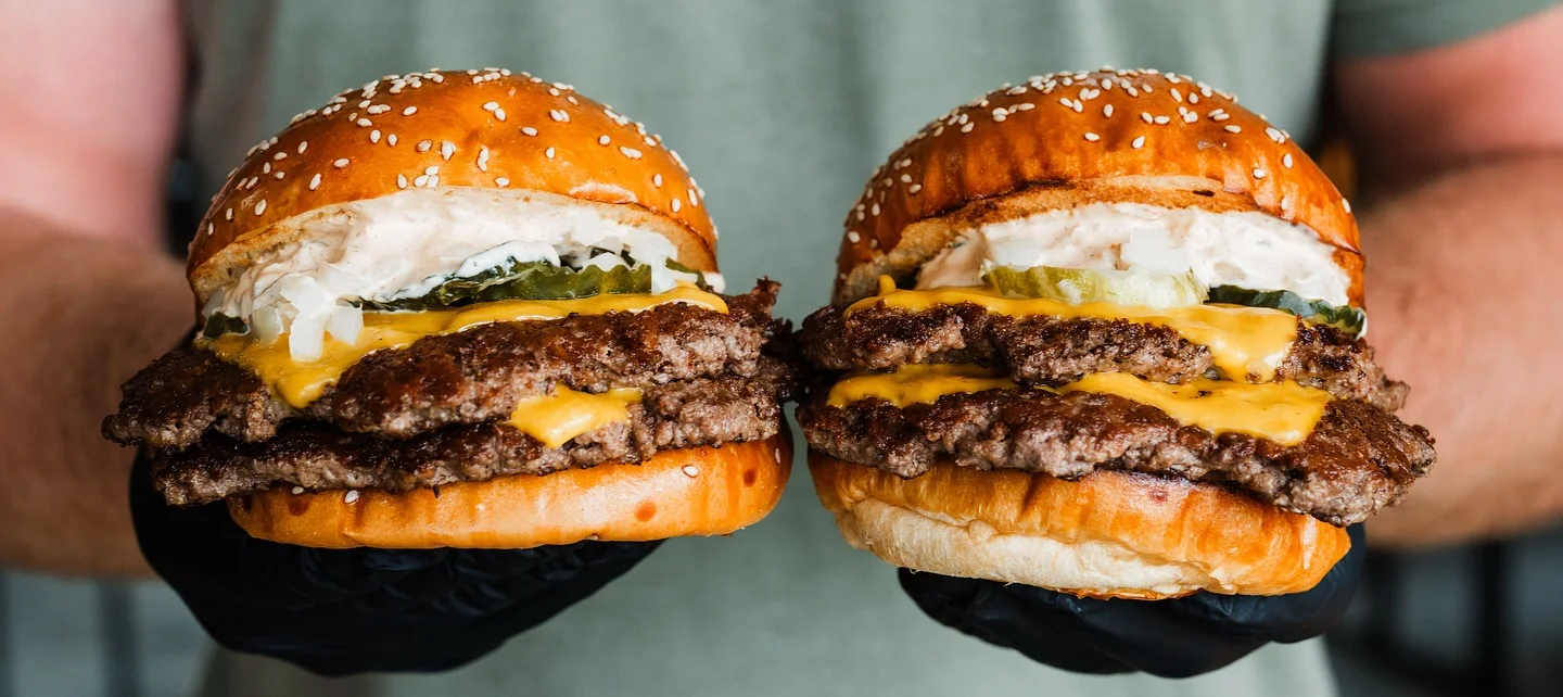 Double cheeseburgers with sesame seed buns