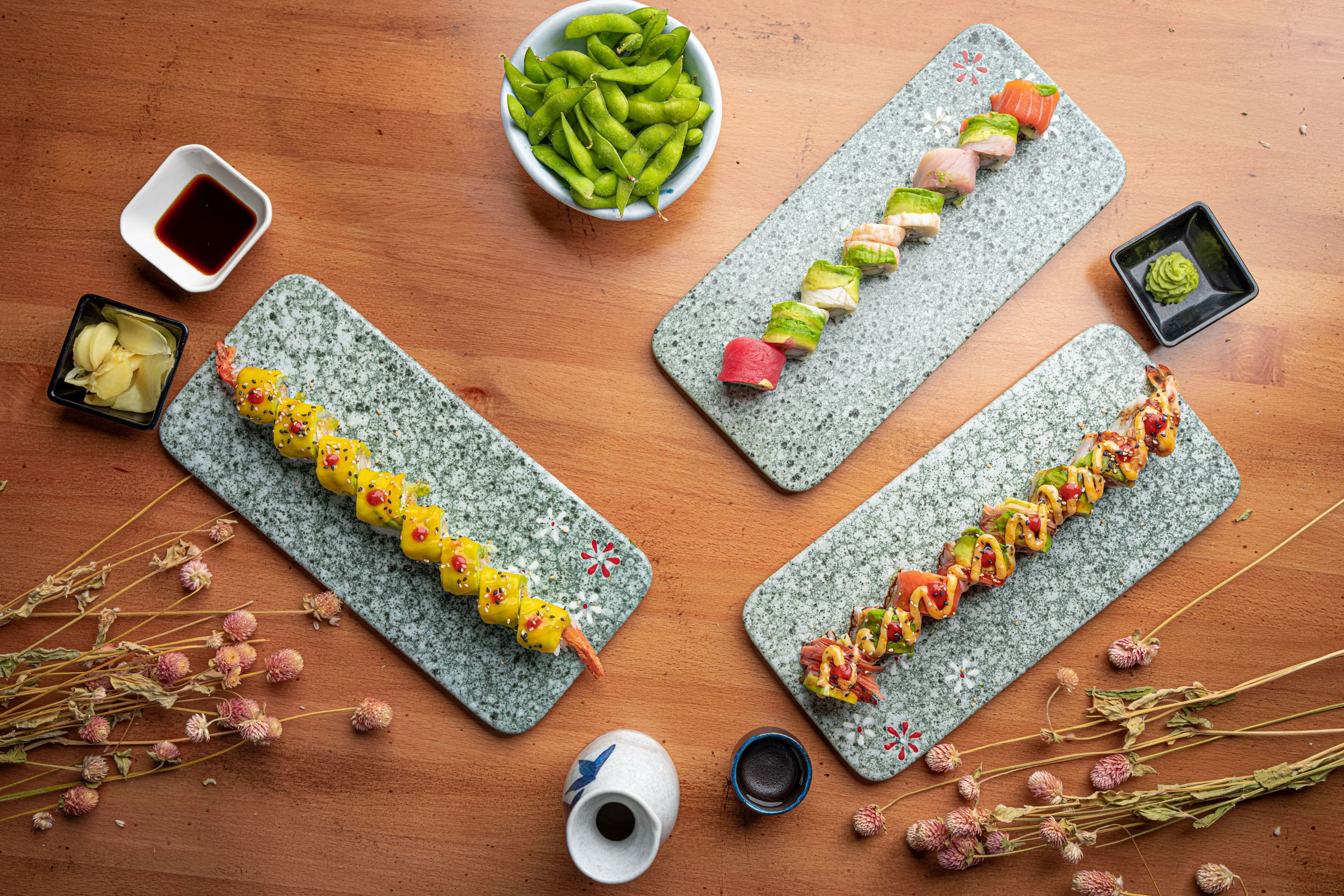 Colorful sushi rolls served on decorative plates