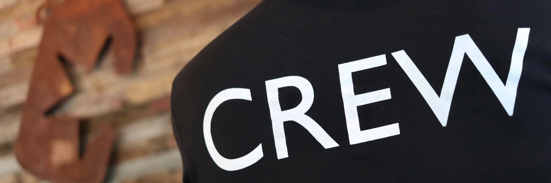 Crew t-shirt in a cozy restaurant setting
