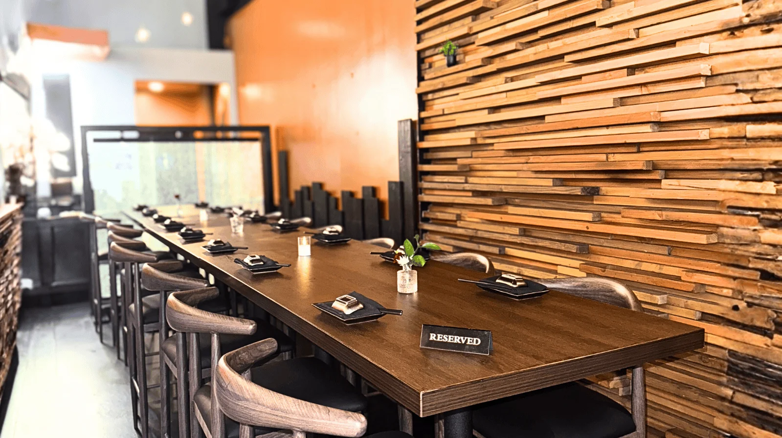 Stylish restaurant interior with wooden accents and reserved seating