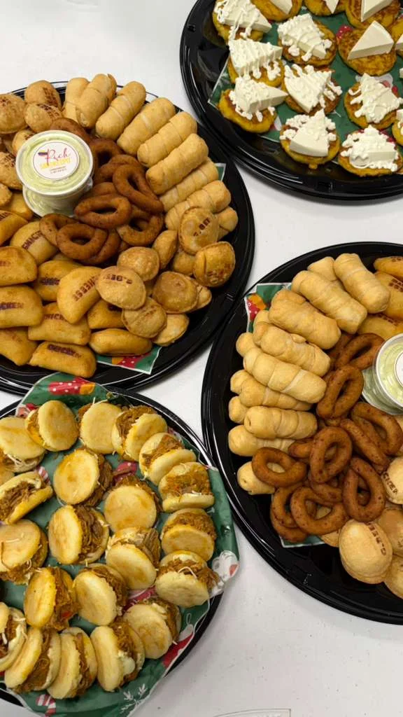 Assorted Latin pastries and savory snacks on festive platters