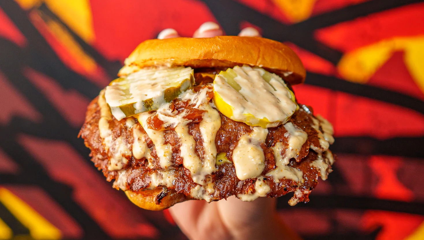 Mashed smashburger with melted cheese and pickles