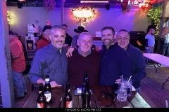 Group of friends enjoying a night out at a lively bar