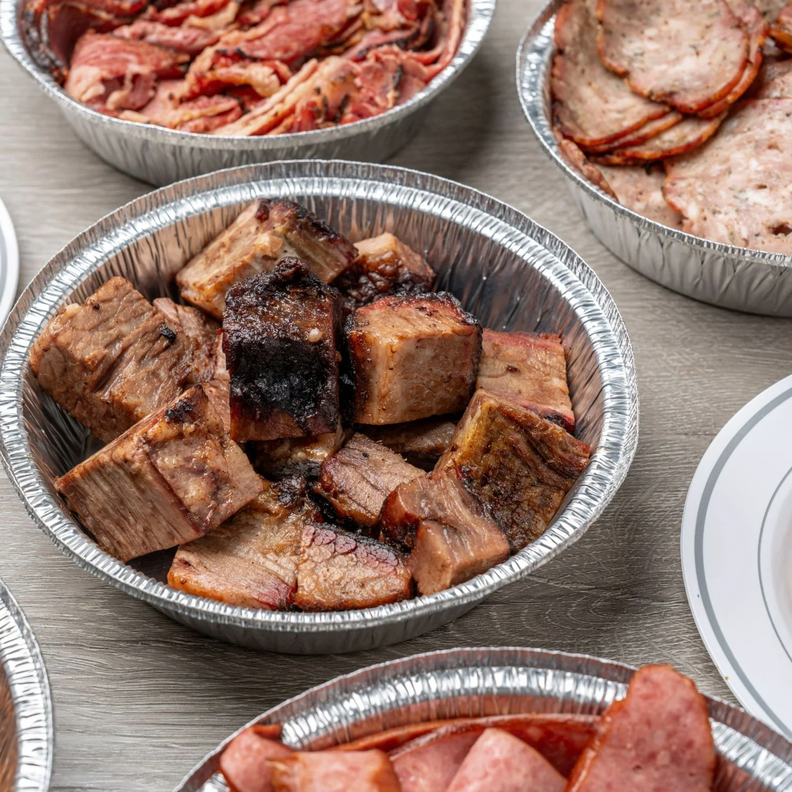 Kansas City barbecue restaurant exterior with brick wall and vintage pig sign