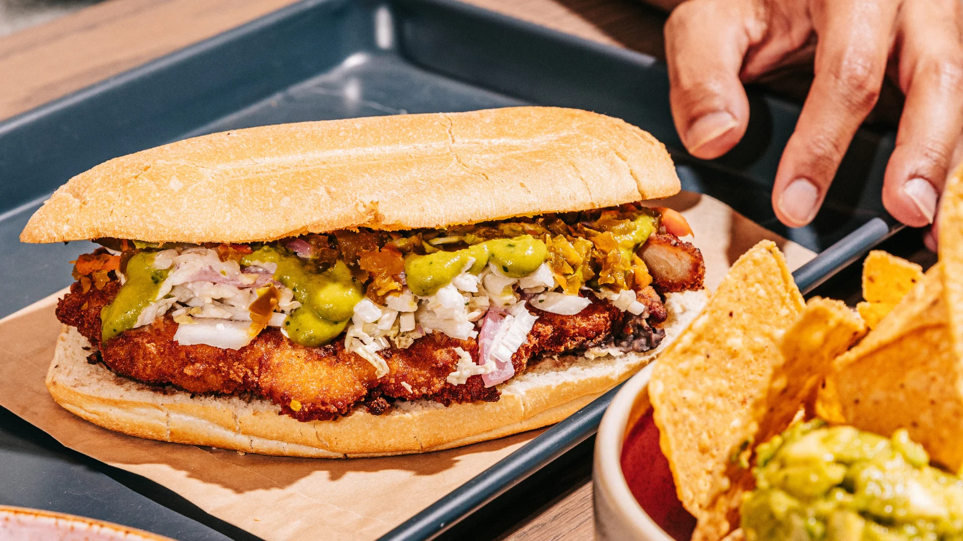 Crispy chicken torta with fresh toppings