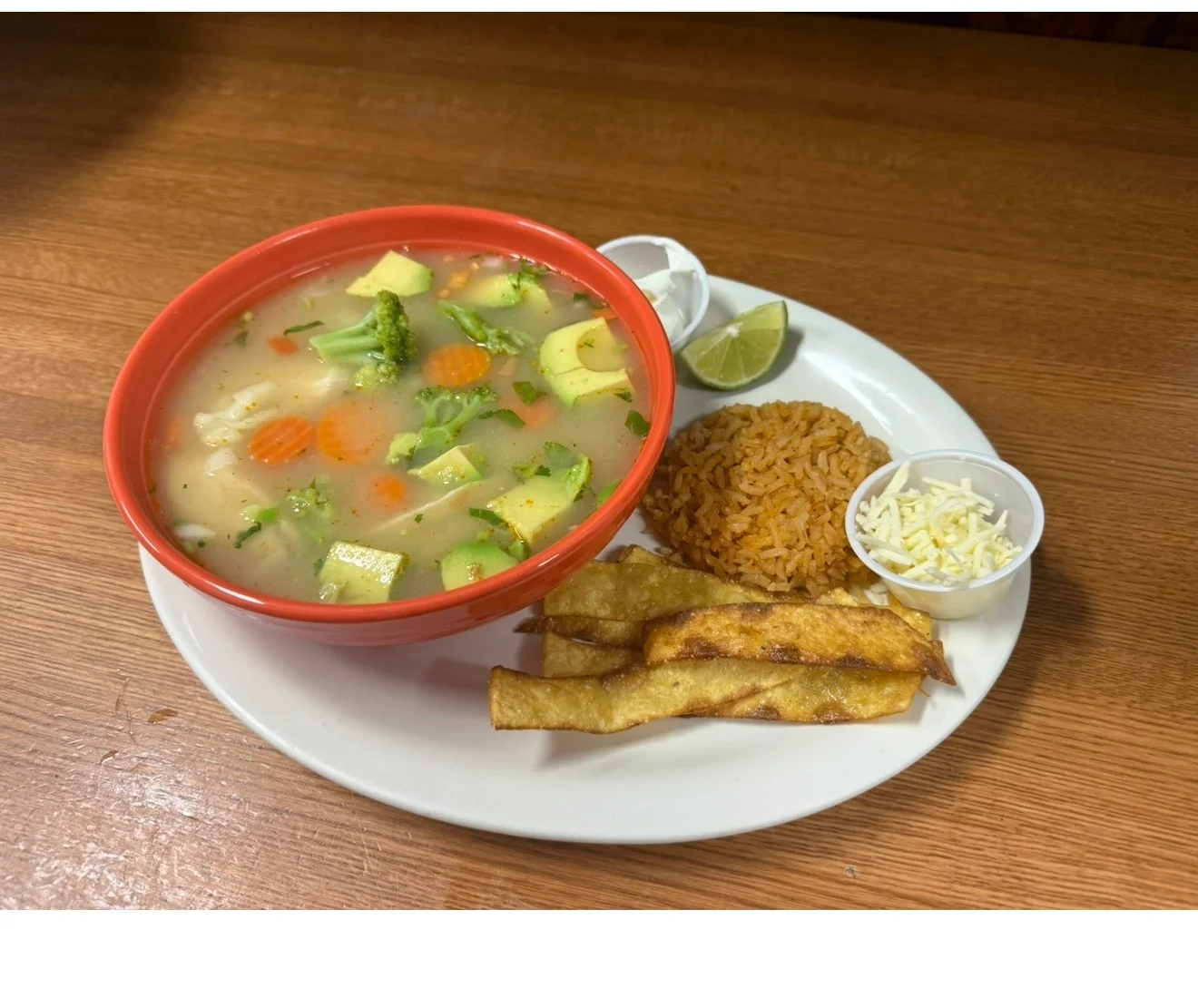 Hearty Mexican vegetable soup with rice and tortilla strips