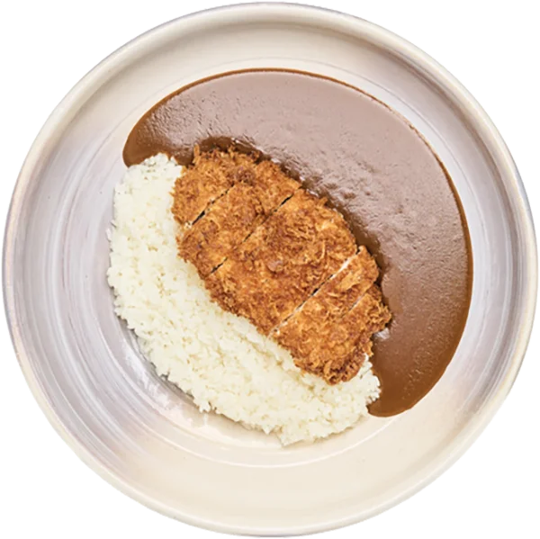 A circular bowl of sliced breaded pork katsu served over rice and dark curry sauce in a ceramic bowl.