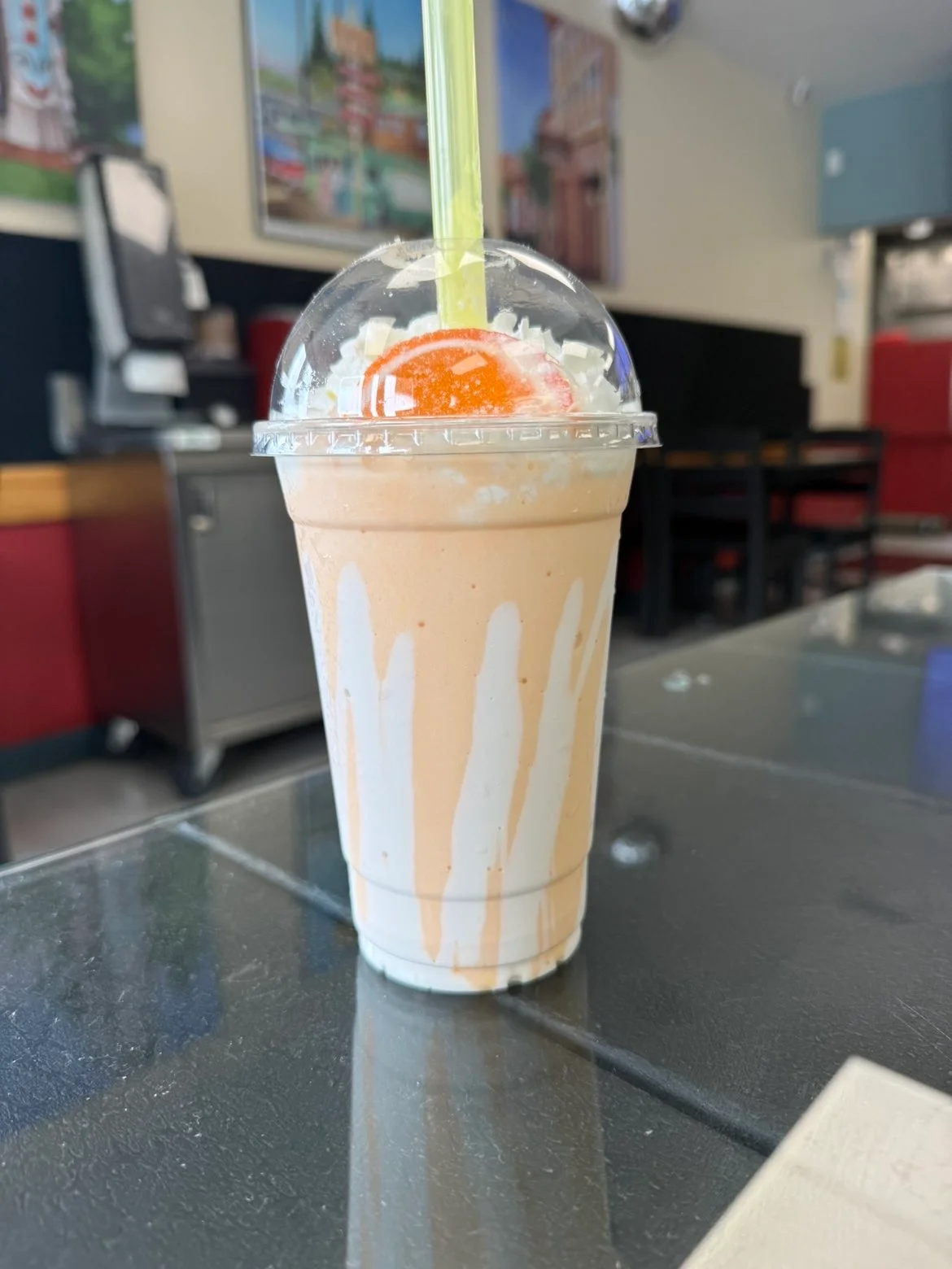 Creamy cookies and cream milkshake topped with whipped cream and an Oreo cookie