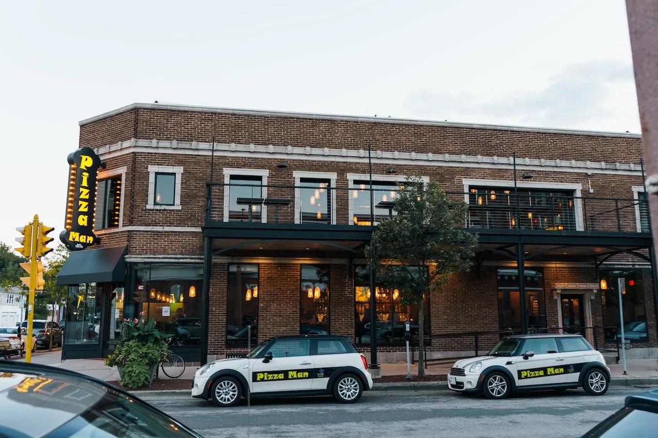 Exterior view of Pizza Man restaurant with modern design
