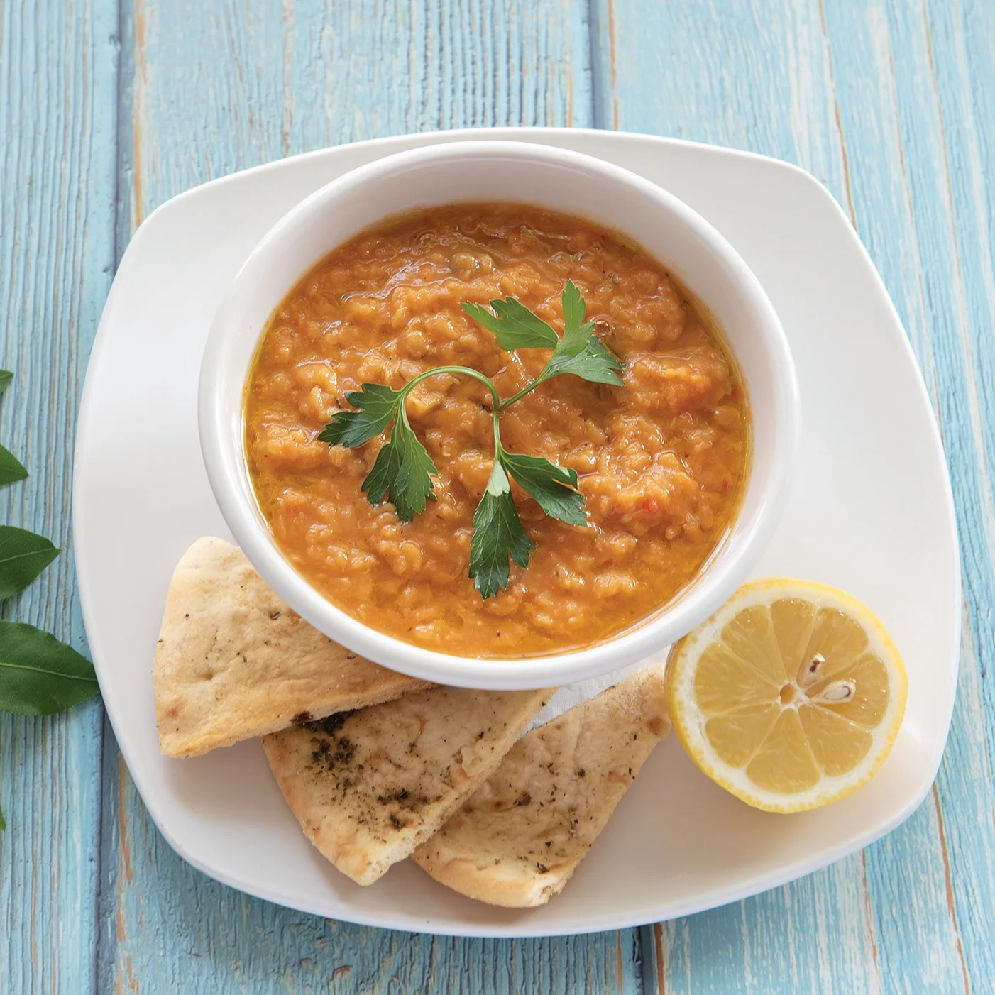 Middle Eastern lentil dip served with flatbread and lemon