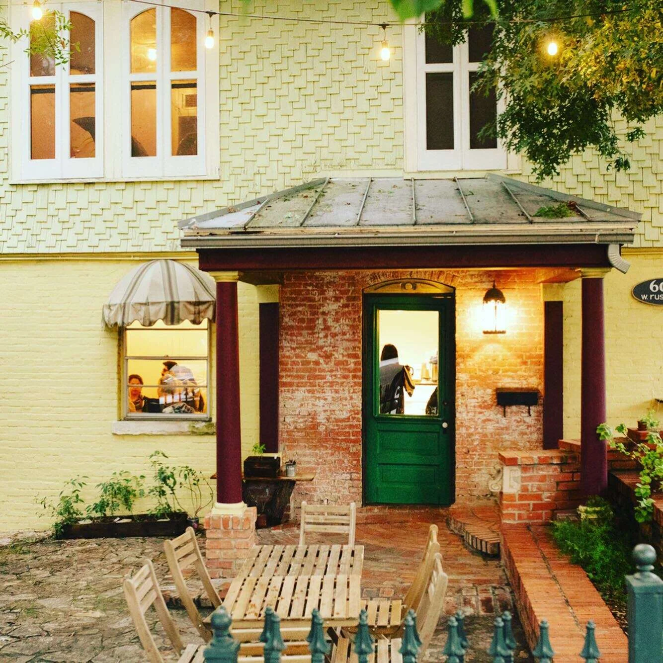 Charming restaurant entrance with warm lighting and rustic decor