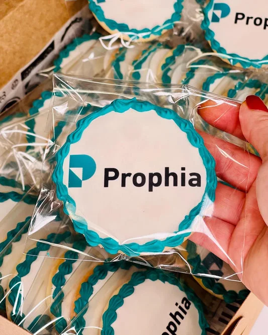 Custom logo cookies in teal packaging for branding events