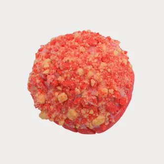 Strawberry Krunch Concha pastry with vibrant pink and white icing.