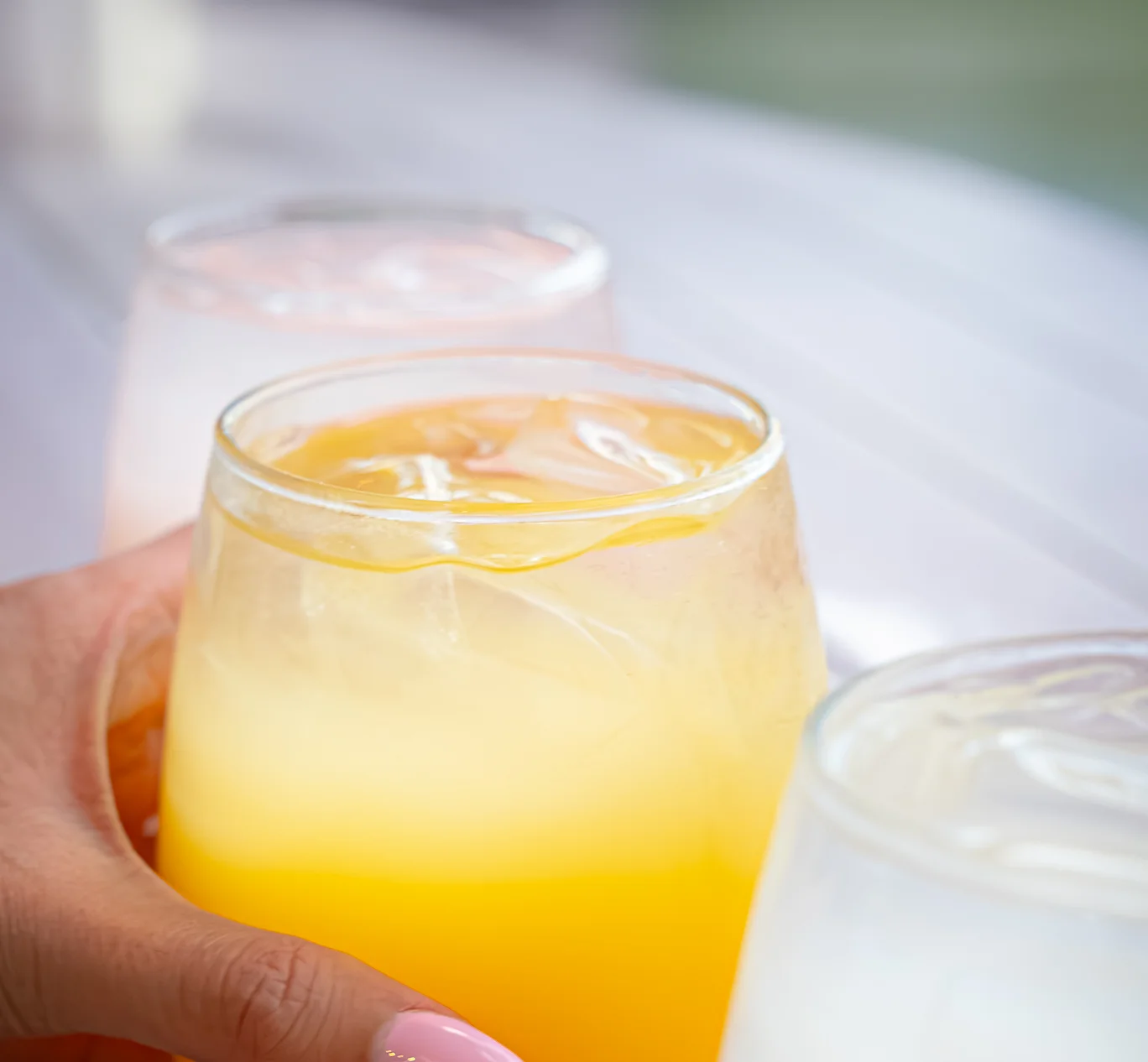 Refreshing tropical cocktail with ice in a glass