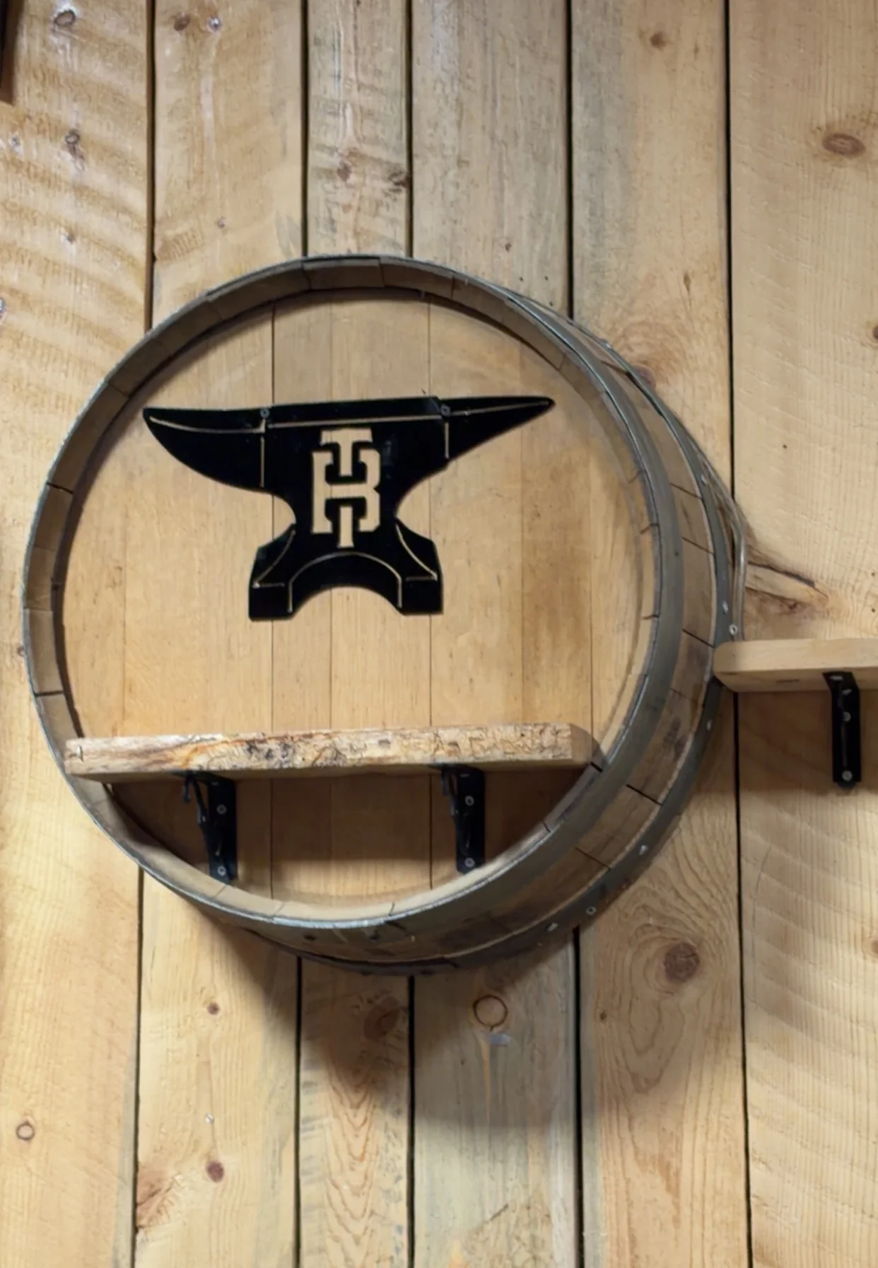 Rustic wooden barrel shelf with an anvil design