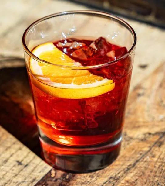 Refreshing Negroni cocktail with orange slice